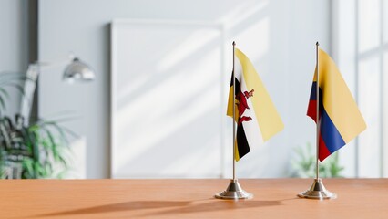 FLAGS OF BRUNEI AND COLOMBIA ON TABLE