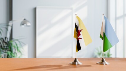 FLAGS OF BRUNEI AND DJIBOUTI ON TABLE