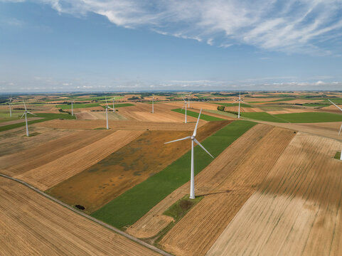 Aerial view of wind turbines in a scenic rural landscape with fields, Son, Ardennes, France.