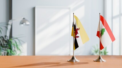 FLAGS OF BRUNEI AND LEBANON ON TABLE