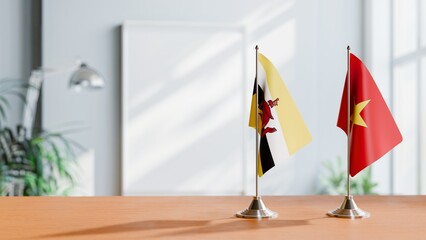 FLAGS OF BRUNEI AND VIETNAM ON TABLE