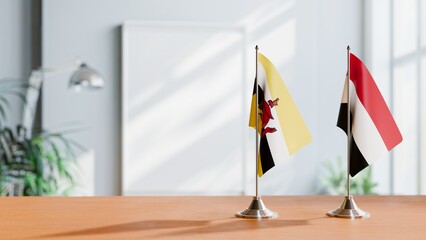 FLAGS OF BRUNEI AND YEMEN ON TABLE