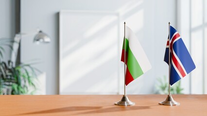 FLAGS OF BULGARIA AND ICELAND ON TABLE