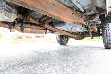 American 4x4 old vintage classic off-road truck rusty strong underneath picture axles shock absorbers yoke differentials muffler. high quality picture for download