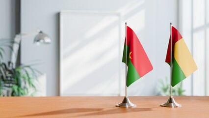 FLAGS OF BURKINA-FASO AND GUINEA-BISSAU ON TABLE