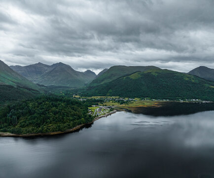 Aerial view of loch leven surrounded by beautiful mountains and forest, Fort William, United Kingdom.