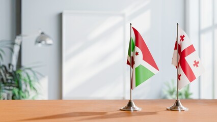 FLAGS OF BURUNDI AND GEORGIA ON TABLE