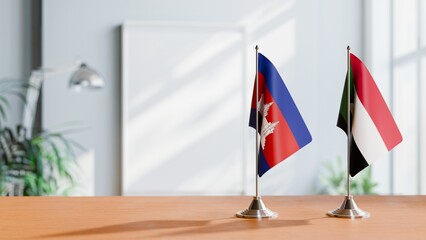 FLAGS OF CAMBODIA AND SUDAN ON TABLE