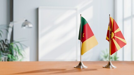 FLAGS OF CAMEROON AND MACEDONIA ON TABLE