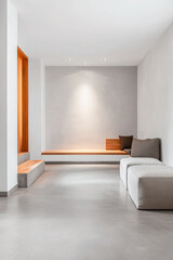 Fototapeta premium A minimalist living room with natural light highlighting wooden accents and a serene color palette in a modern home setting