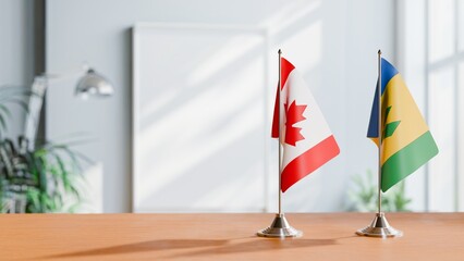 FLAGS OF CANADA AND SAINT VINCENT ON TABLE