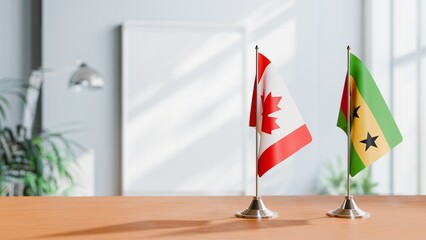 FLAGS OF CANADA AND SAO TOME ON TABLE