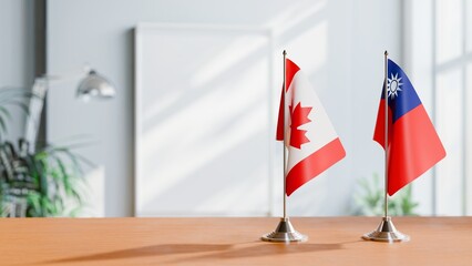 FLAGS OF CANADA AND TAIWAN ON TABLE