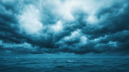 Fototapeta premium Dark clouds loom over a turbulent sea, reflecting the dramatic interplay of light and shadow in a moody, atmospheric landscape.