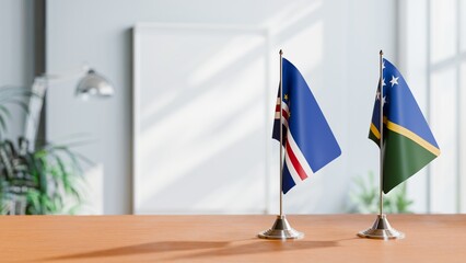 FLAGS OF CAPE VERDE AND SOLOMON ISLANDS ON TABLE
