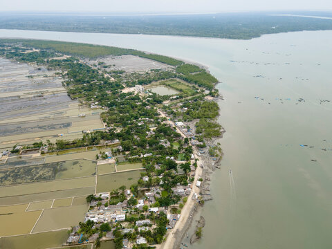 Aerial view of fish farming fields and mangroves along the Sundarban river, Khulna, Bangladesh.