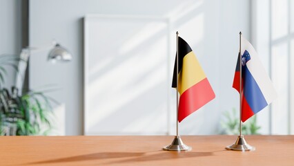 FLAGS OF CHAD AND SLOVENIA ON TABLE