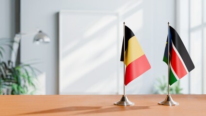 FLAGS OF CHAD AND SOUTH SUDAN ON TABLE