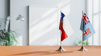 FLAGS OF CHILE AND FIJI ON TABLE