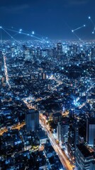 Fototapeta premium Aerial view of a vibrant city skyline at night, illuminated by lights and digital connections.