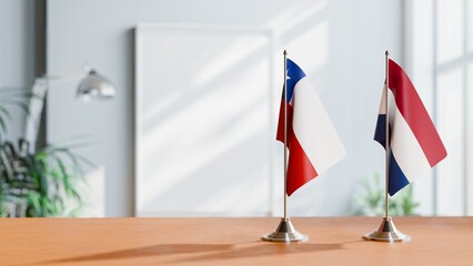 FLAGS OF CHILE AND NETHERLANDS ON TABLE