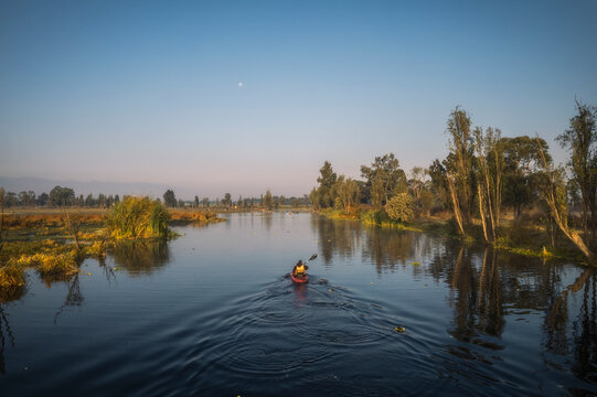 Aerial view of tranquil Xochimilco with kayaks under the moon, Mexico City, Mexico.