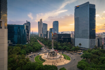 Aerial view of angel de la independencia and paseo de la reforma at sunset with a vibrant skyline, Cuauhtemoc, Mexico.