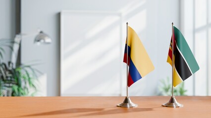 FLAGS OF COLOMBIA AND MOZAMBIQUE ON TABLE