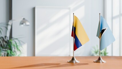 FLAGS OF COLOMBIA AND SAINT LUCIA ON TABLE