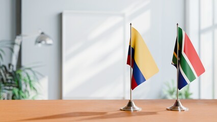 FLAGS OF COLOMBIA AND SOUTH AFRICA ON TABLE