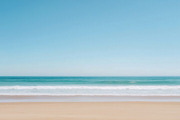 A beautiful beach with a calm ocean and a clear blue sky