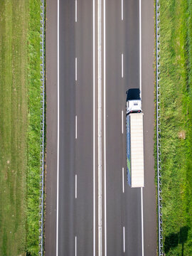 Aerial view of a busy highway with trucks and lorries, Santa Maria di Campagna, Cessalto, Treviso, Italy.