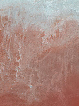 Aerial view of abstract patterns and textures in a serene landscape, Aigues-Mortes, France.