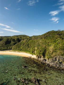 Aerial view of Adan Beach with clear water and sandy shore, Kunigami Son, Okinawa, Japan.