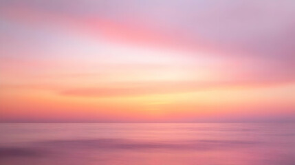 Obraz premium Abstract Background with Soft Pink and Yellow Hues of a Colorful Sunset Over the Ocean