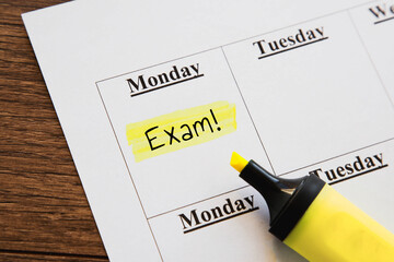 planner calendar monday with highlighted inscription text exam, education concept