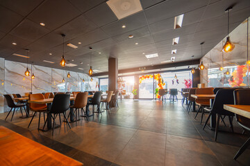 Interior of bar with wooden furniture. Wide shot restaurant interior