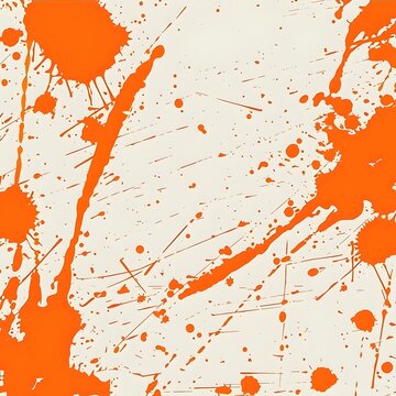 Abstract orange splatter design on a light background, creating a dynamic visual effect.