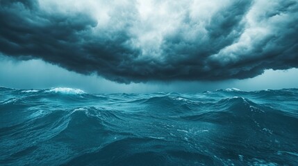 Fototapeta premium Dramatic seascape featuring dark storm clouds above turbulent ocean waves, capturing the power of nature in a mesmerizing composition.