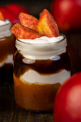 fresh yogurt with jam and pieces of ripe nectarine