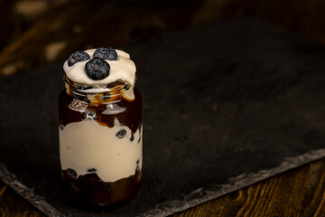delicious blueberry-flavored yogurt in a glass jar