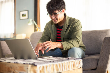 asian man work using computer hand typing laptop keyboard contact us.student study learning education online.adult professional people chatting search at office.concept for technology device business