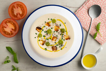 Spanish tapa cold soup of ajoblanco with grapes. Top view table with  decoration.