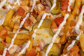 pizza with pickled cucumbers and French fries