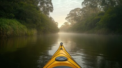 Fototapeta premium A tranquil kayak view on a misty river, surrounded by lush greenery and calm waters.