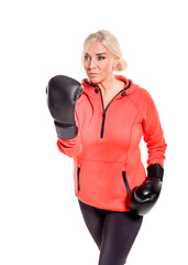 Confident Woman Training in Boxing Gloves