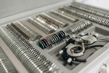 Close up optical trail frame and len kits tray for eye patient examination in eyewear shop