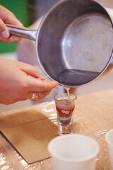 glass glass with multi-colored bulk candles. hobby and master class on making simple and beautiful candles with your own hands.