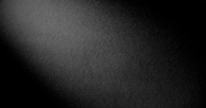 Black rough paper surface, slow moving. Use for background and texture.