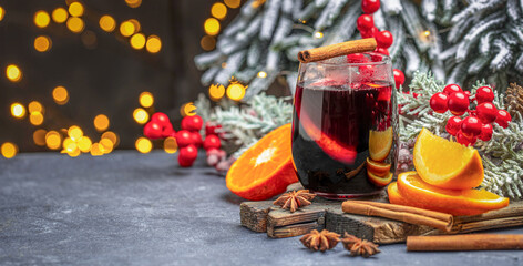 Christmas mulled wine with spices and oranges, festive cocktail